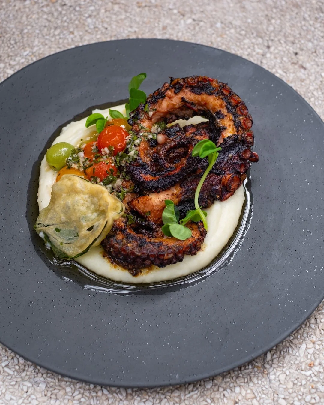 Perfectly charred, tender within. Copper's octopus meets creamy mash, grilled tomato, and a bright chimichurri finish. 🔥🌿 #UbudEats #APerfectBite

CHARRED OCTOPUS
mashed potato, grilled tomato, crispy spinach, chimichurri
+ dinner main

Book A Tabl