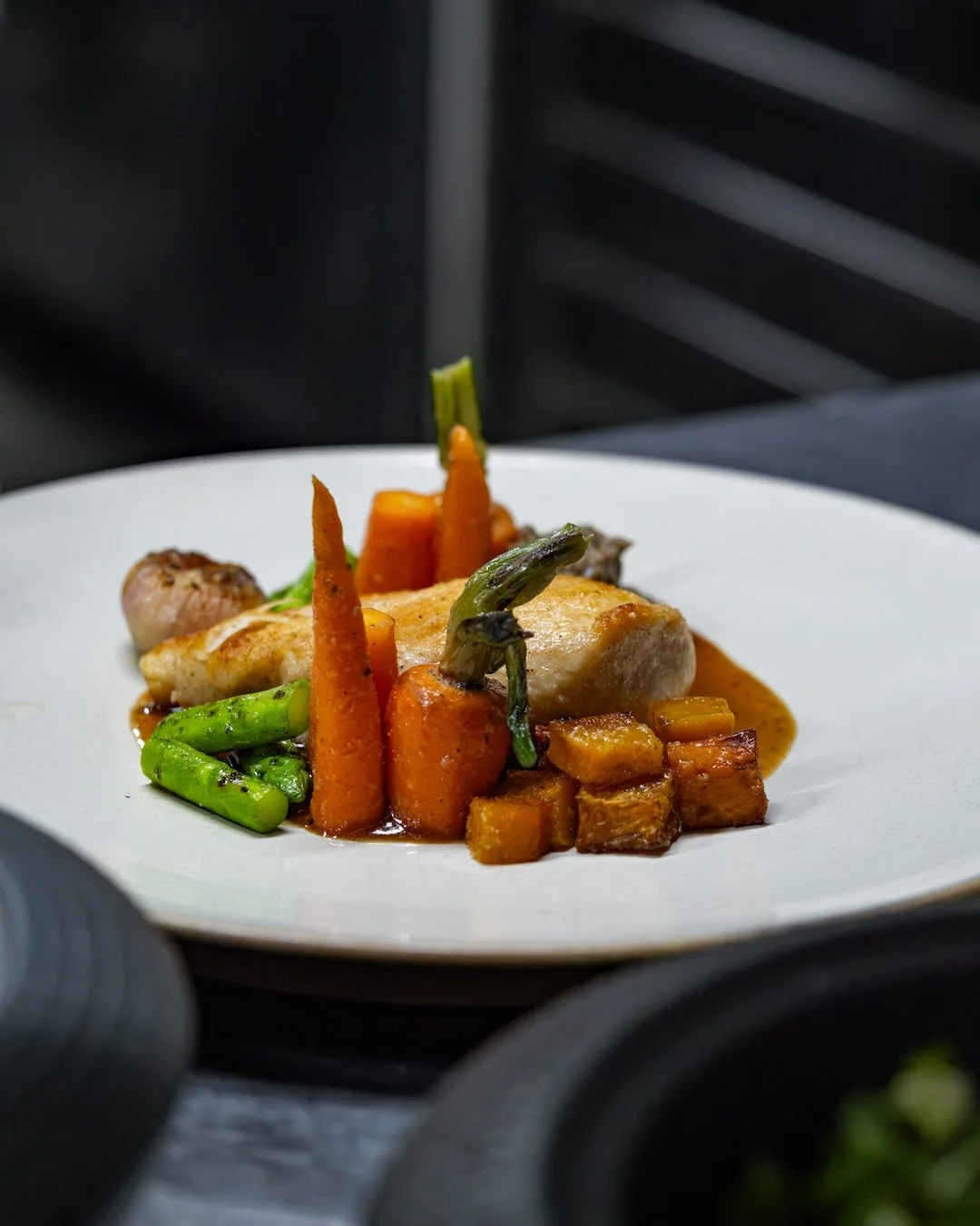 Behind every plate is a story of patience and craftsmanship.

From the slow-cooked Sous Vide Chicken Breast to the rich port wine jus, comforting brodo di pollo, creamy butternut squash, and fresh garden herbs, every element is thoughtfully prepared 