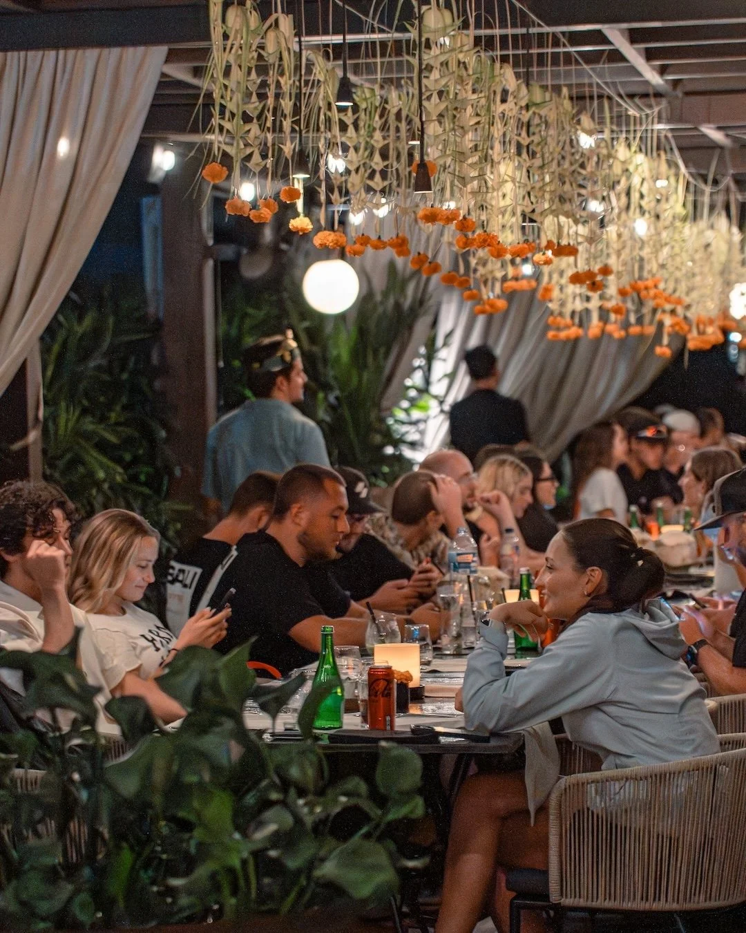 group diners on the rooftop in ubud at copper