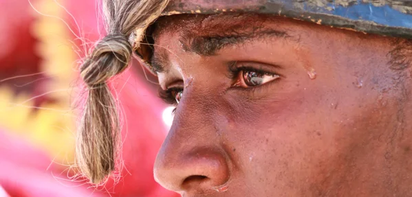 Man wearing a mask at Carnival in Jacmel, Haiti
