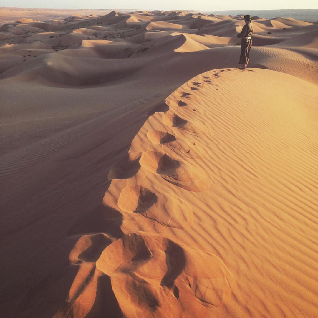 Nick in full Bedouin garb on the dunes of Wahiba Sands