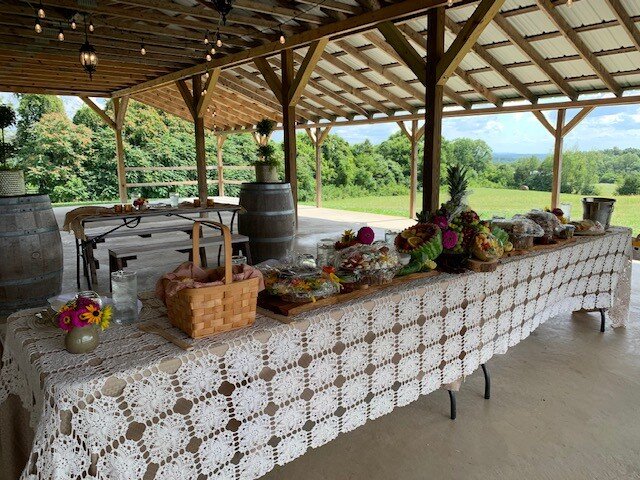 Getting ready to welcome our guests with a beautiful, floral adorned, charcuterie style picnic @colleyhillfarm ❤