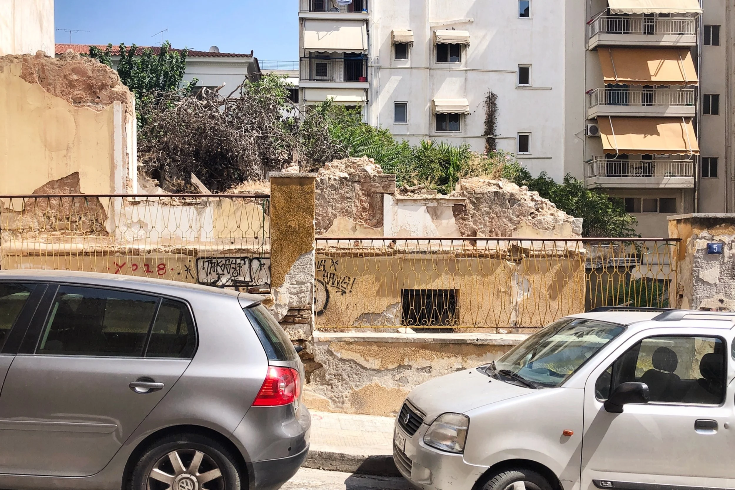 Athens: The Cracks in the Concrete