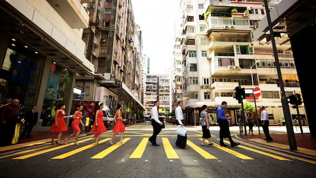 Wedding party crossing street in Causeway Bay