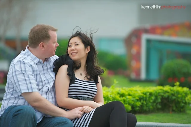 Hong-Kong-engagement-session-portraits-couple-ifc-mall-rooftop-outdoor-groom-bride-sitting-smiling