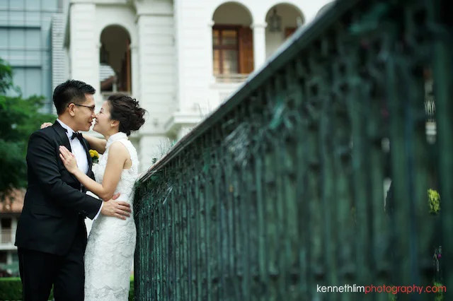 Hong Kong 1881 Heritage engagement photoshoot bride kissing groom leaning