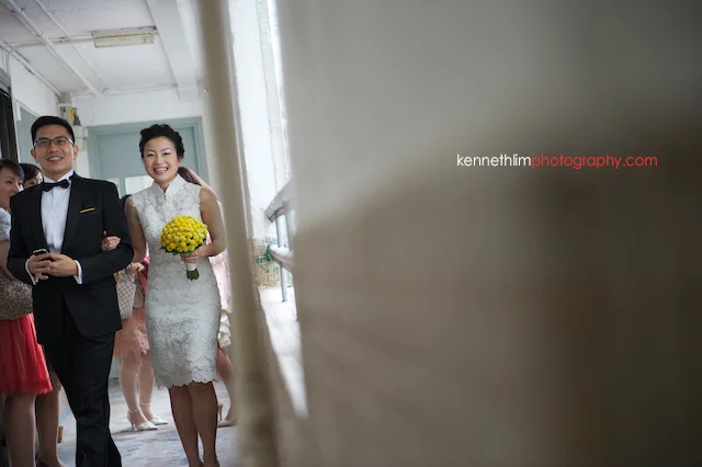 Hong Kong wedding morning groom bride walking down corridor laughing