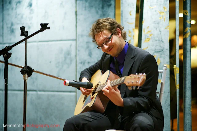 Hong Kong Country Club wedding dinner friend playing guitar