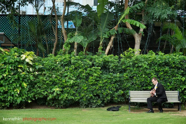 Hong Kong Country Club wedding groomsman practicing solo guitar