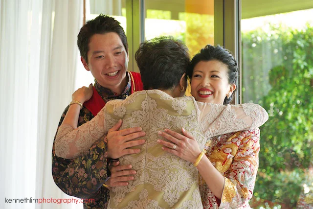 Koh Samui wedding Shasa Resort bride and groom hugging mother of groom