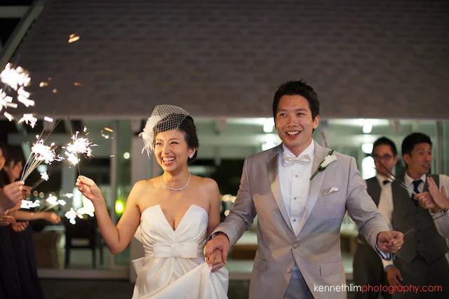 Koh Samui wedding YL Residence bride and groom laughing and smiling with sparklers in hand