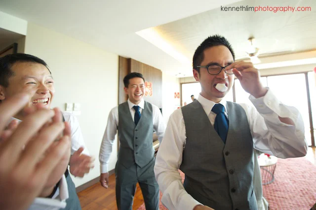 Koh Samui wedding Shasa Resort groomsmen playing games and laughing tears in eyes