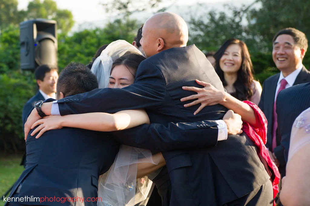 Hong Kong Wedding photography one thirty one after ceremony bride hugging family