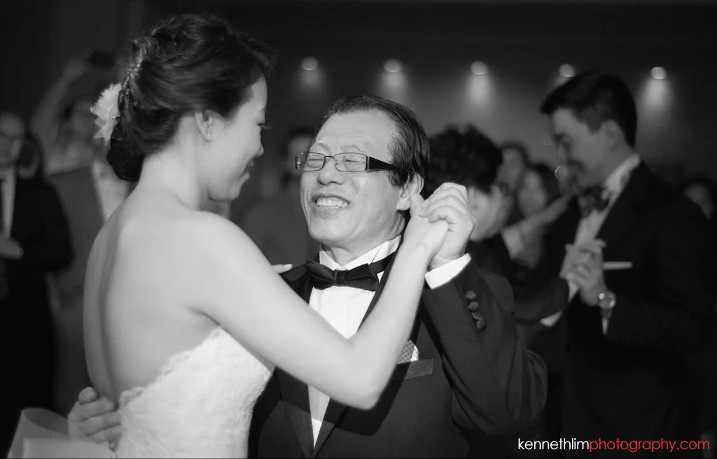 NYC Garys Loft wedding day photography evening bride and father dancing laughing together