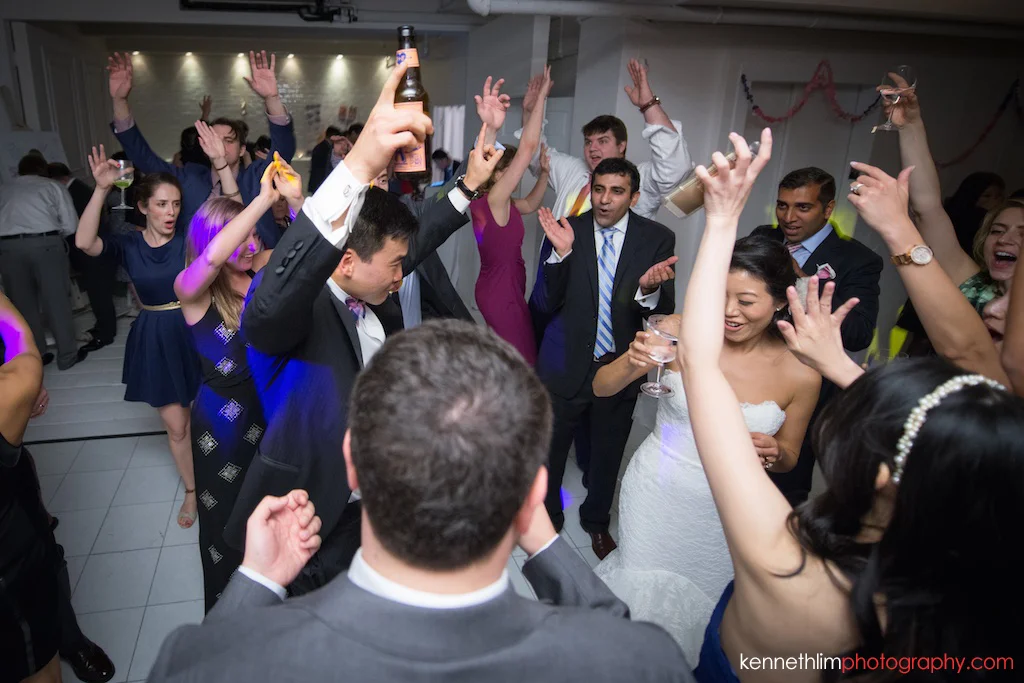 NYC Garys Loft wedding day photography bride and groom toasting to guests on the dance floor