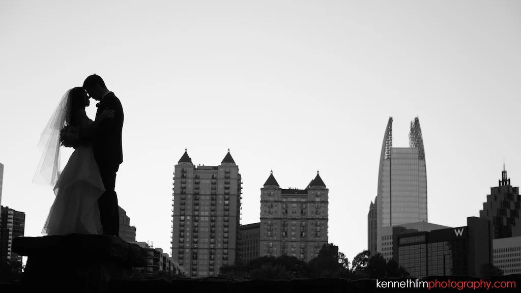 Atlanta wedding the Greystone Piedmont Park brid and groom kissing outside portrait session photography