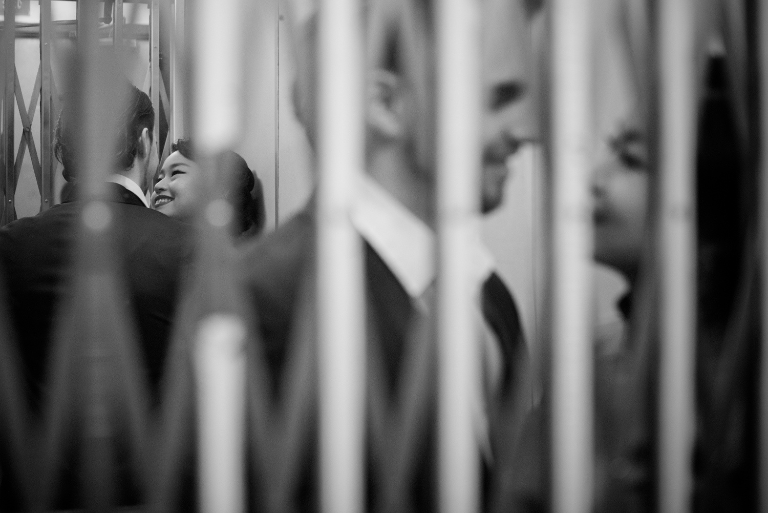 hong-kong-pre-wedding-engagement-photographer-couple-in-elevator-together-north-point.jpg