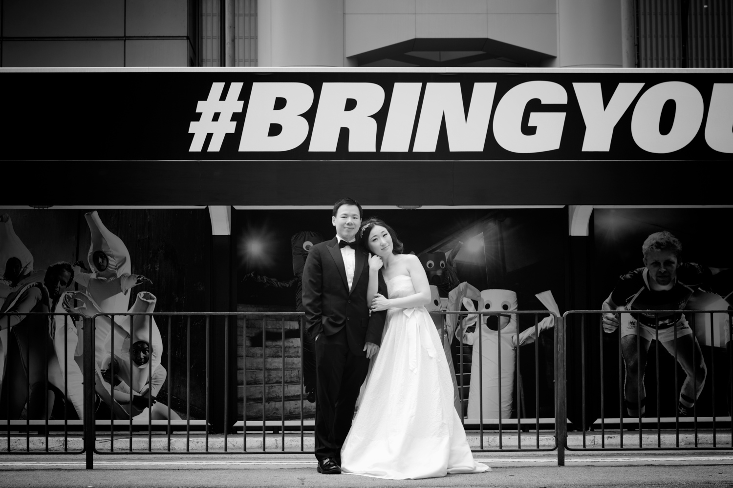 hong-kong-pre-wedding-photographer-couple-in-front-of-tram-black-and-white-central-hsbc-building.jpg