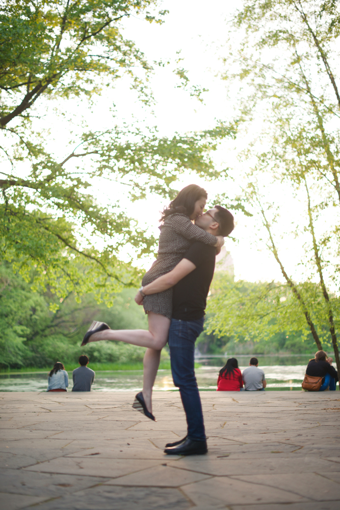 new-york-engagement-photographer-central-park-couple-kissing-in-air-together.jpg