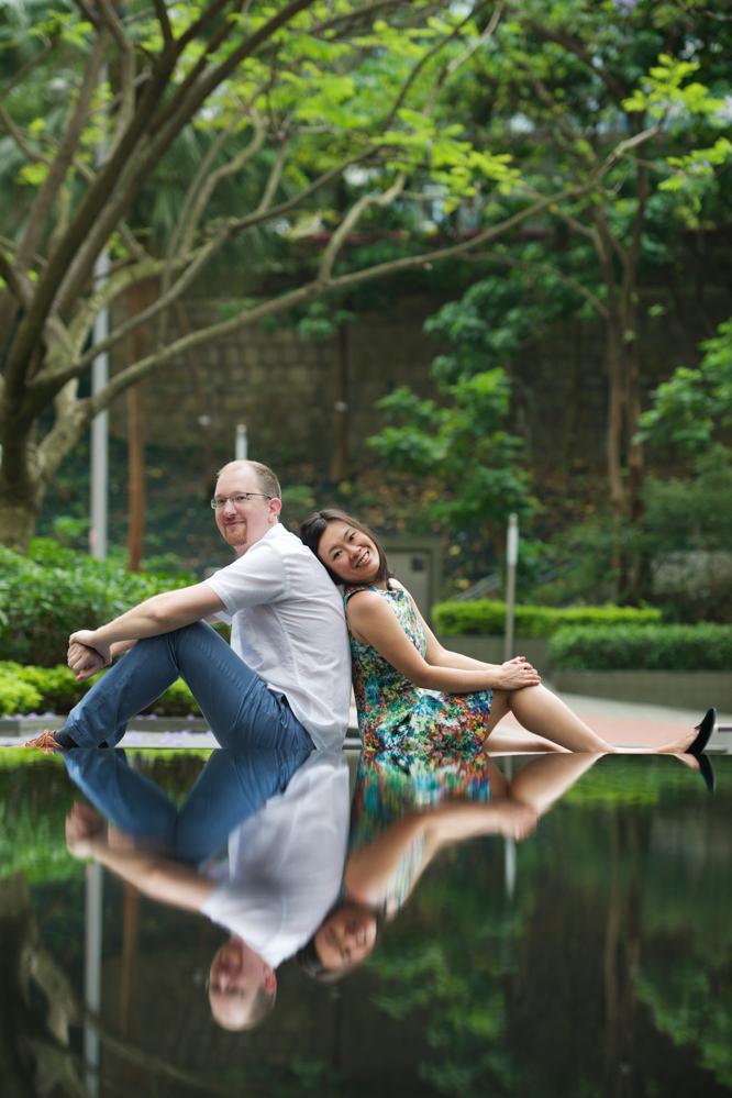 hong-kong-pre-wedding-engagement-photographer-couple-sitting-with-water-reflection-hong-kong-park.jpg
