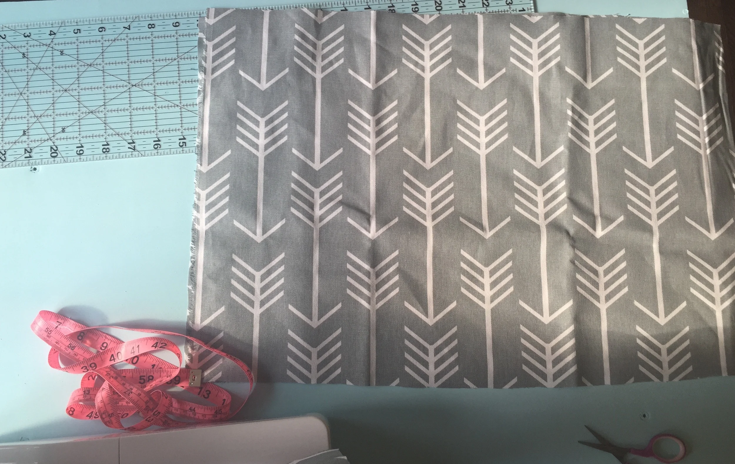 Then cut two pieces (these will be your "envelopes") to the desired size. My measurements for these two were 22x14. To find your envelope size, take your first measurement add 6 then divide by 2! Ex: 22+6=28. 28 divided by 2= 14 making measurement 22x14 .