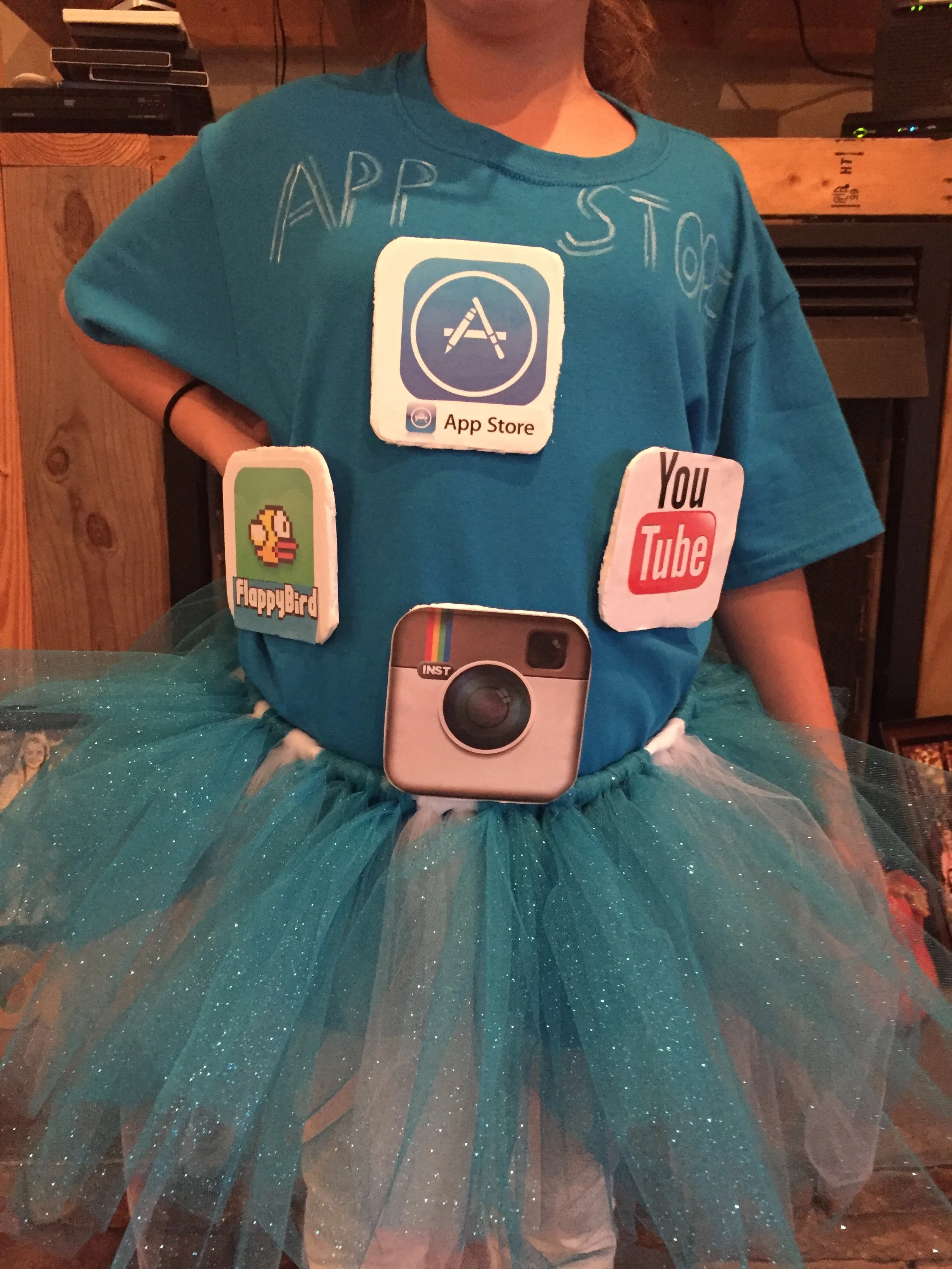 Print out the desired apps & use mod podge to adhere the sheets of paper to board! 