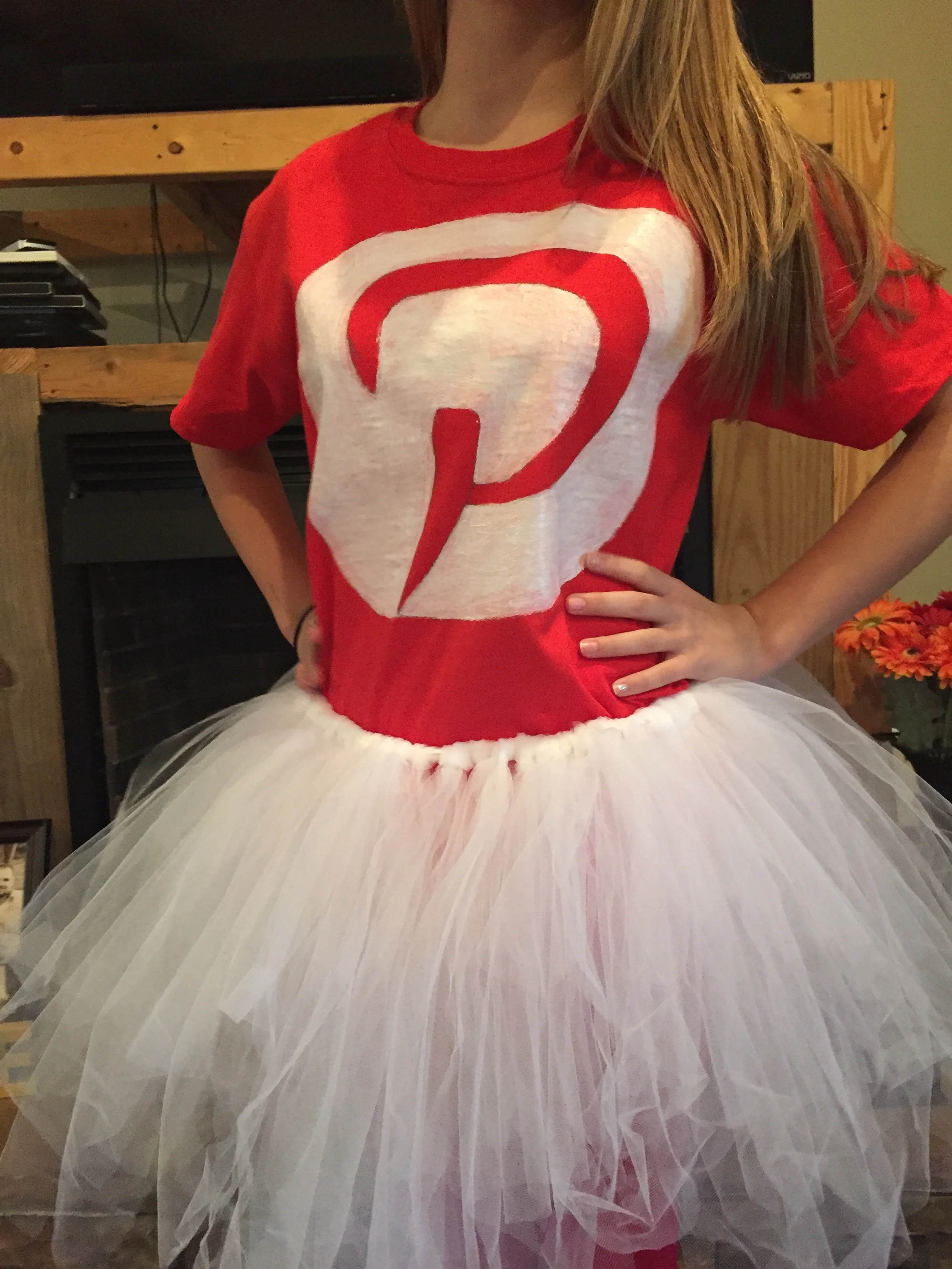 I free handed the Pinterest logo onto a tshirt and then filled it in using white fabric paint!