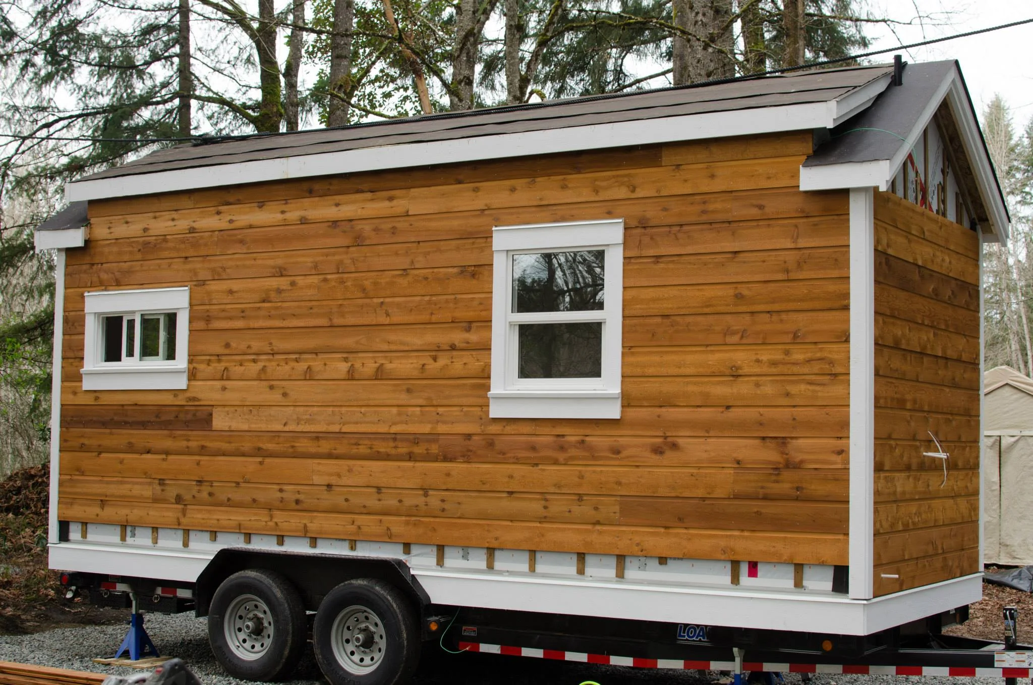 We used local custom-milled cedar, sustainably harvested on Vancouver Island. The finish is a slightly rough-cut and stained to hold its colour.