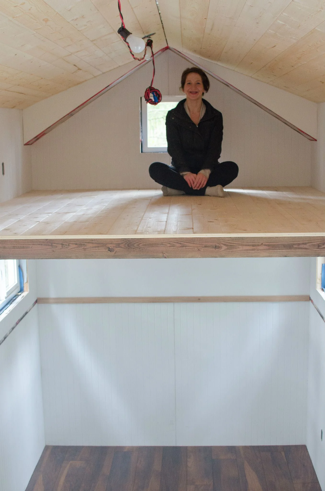 There is way more head room than expected in the loft. The floor is a nice light pine.