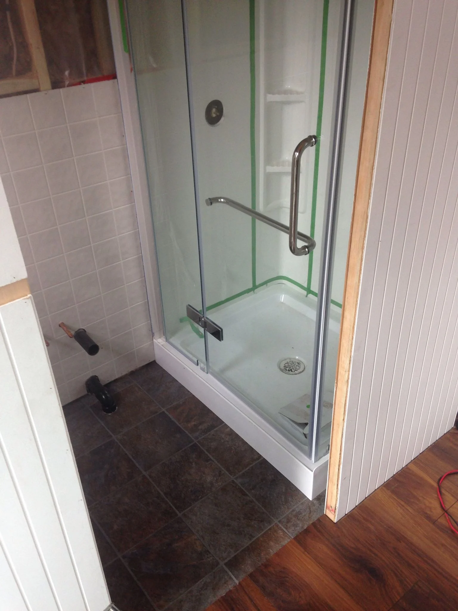 For the ladies: a full size glass shower & laminate tile flooring in the bathroom. The door slides behind the shower, and is opaque to let the light through even when closed (but still give you privacy!).
