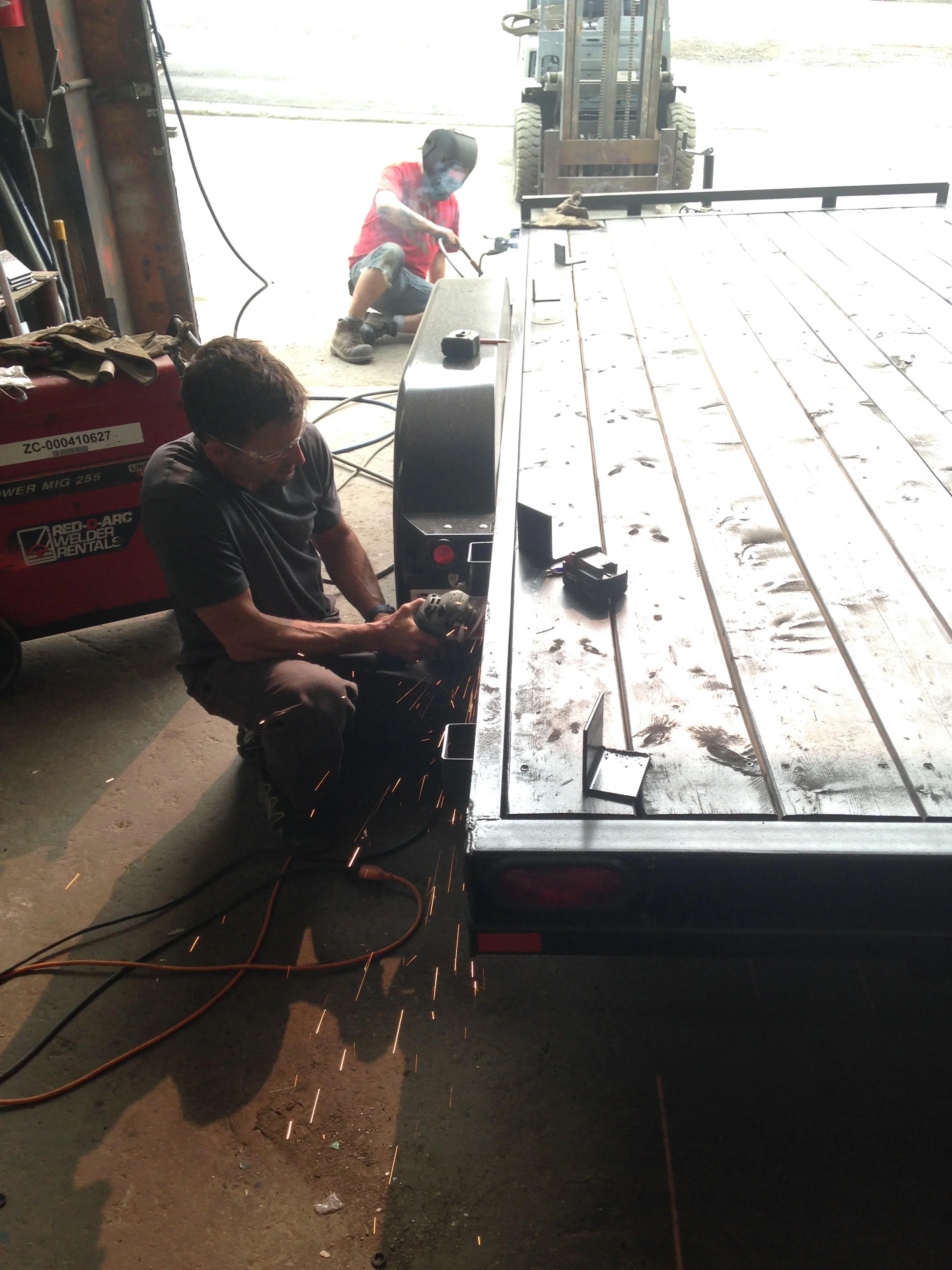 Our lead builder Brad putting some finishing touches on the trailer.