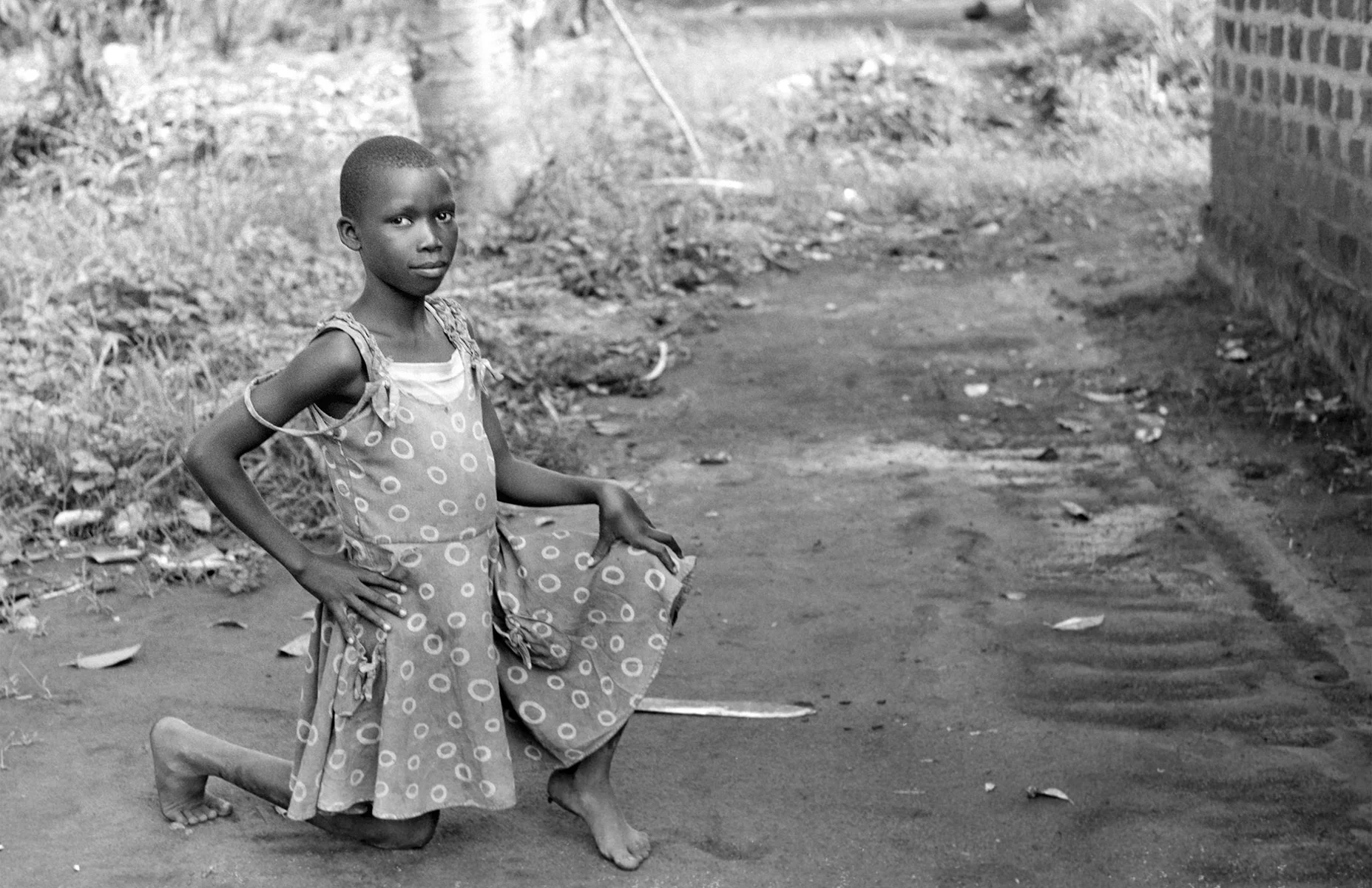 Photographer: Babigumira Florence. Age; 42 years. Occupation: Farmer. "Meet my beautiful daughter, Namugaya Esther. I am so proud of her because she has passed her entrance exams and will go on to senior primary schooling at a boarding school in Kampala next Fall. We could not have done this without the educational supports provided to us by Aaron Bukenya and his BESO team. We feel so blessed."