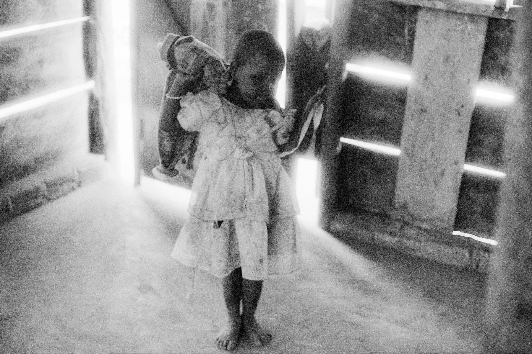 Photographer: Anyango Florence. Age: 29 years. Occupation: Teacher at BESO Junior School. "This is one of my students in the Baby Class at BESO Junior School. She is inside the first classroom that we ever built with the microgrant from Spark in 2010. Today, through our community efforts, we have expanded our school significantly and have three brick buildings with more permanent classrooms. We are so proud of the progress we have made."