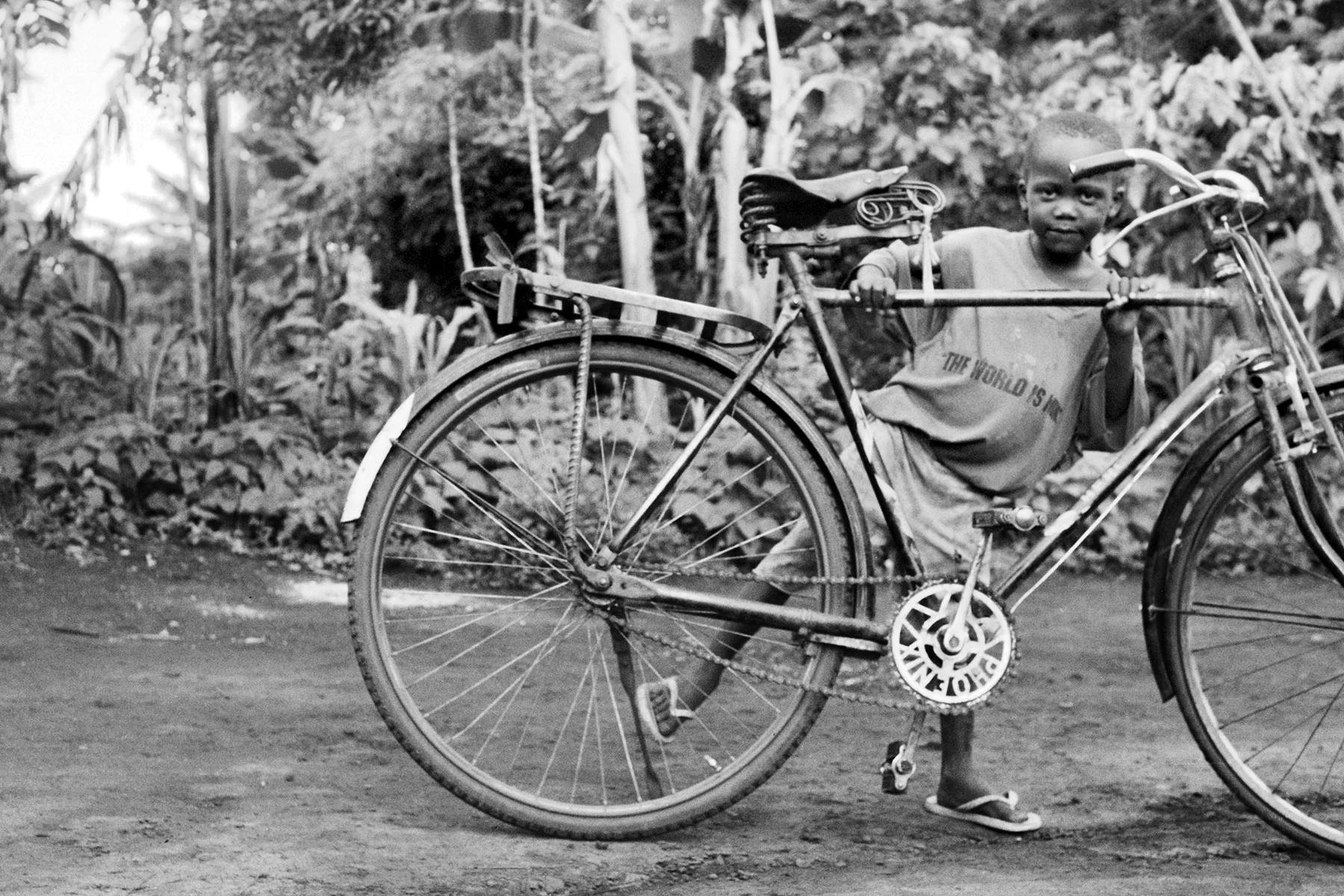 Photographer: Gladys Namugaya. Age: 30 years. Occupation: Farmer. "My son Bakaki Bright who goes to BESO Junior School was practicing how to ride a bicycle. He is five and a half years old. He is happy because he is in school. And I am happy because we now have access to affordable education at a nearby school. "