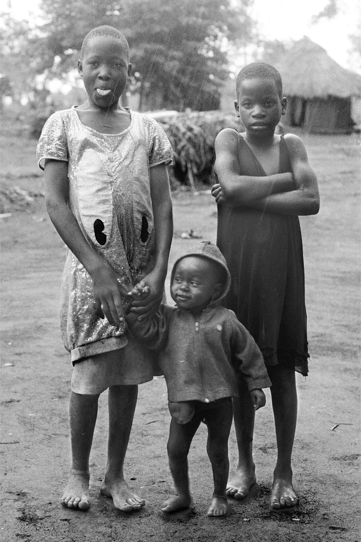 Photographer: Jamadah Mawoni. Age 21 years. Occupation: Teacher at BESO Junior School. "I took this picture to show you our local fashions. When I walk around the village I see so many half-naked children. This is a problem. It means the parents cannot afford to buy good clothes for their children. I work hard so as to provide my son with enough clothes."