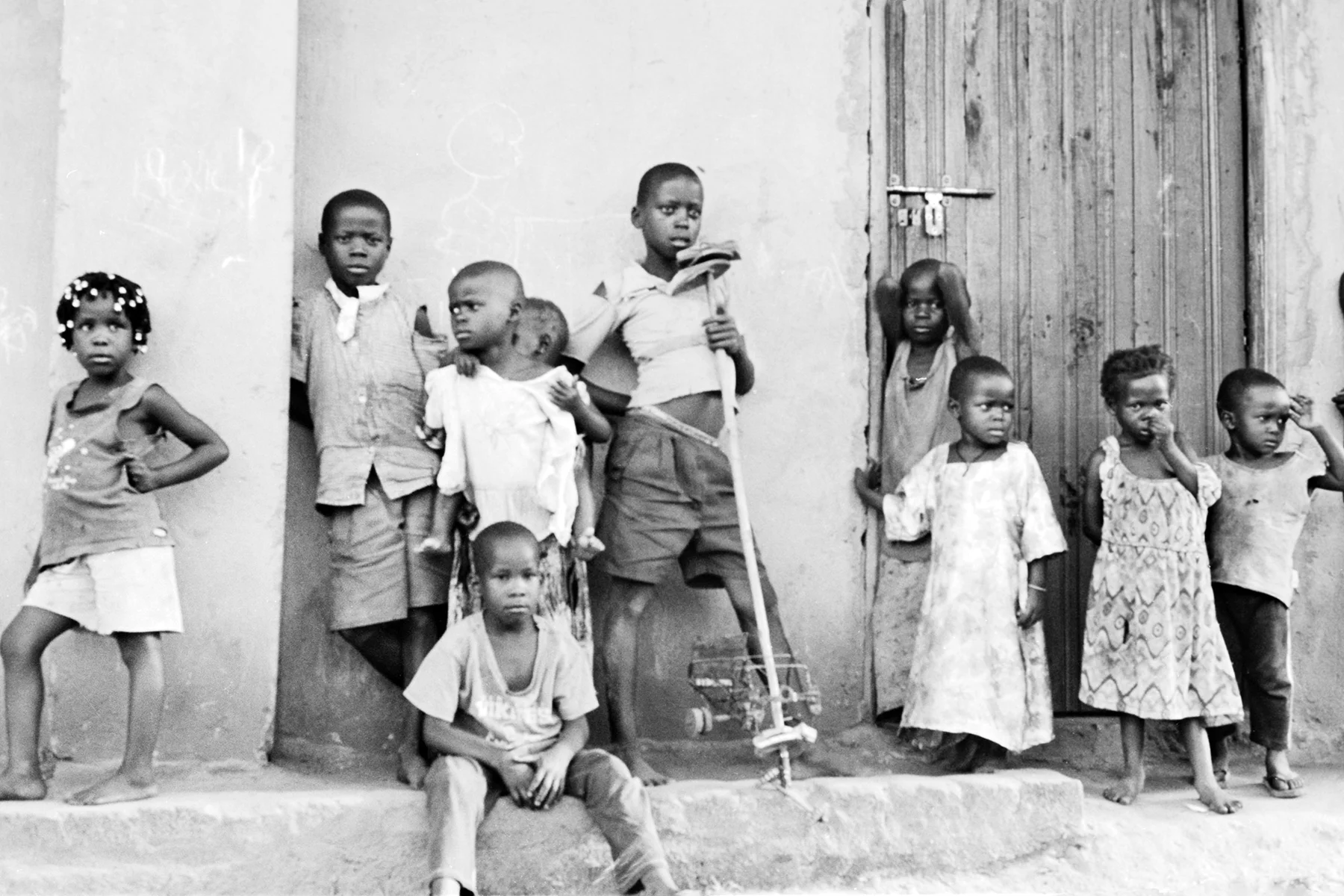 Photographer: Athieno Jane. Age: 42 years. Occupation: Farmer & BESO Junior School Cook. "These are some of the students at BESO Junior School that we support. They are playing in the schoolyard after hours."