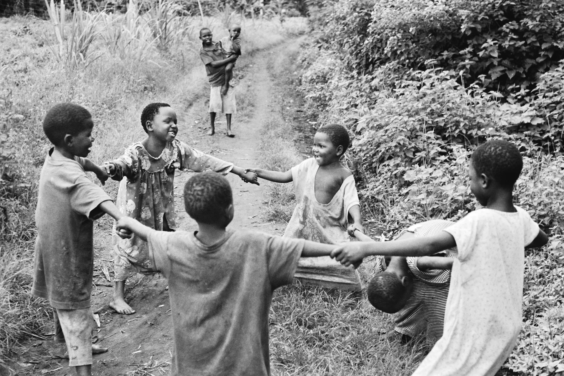 Photographer: Athieno Jane. Age: 42 years. Occupation: Farmer & BESO Junior School Cook. "There is nothing that gives me greater joy than seeing children playing after a long and hardworking day at school."