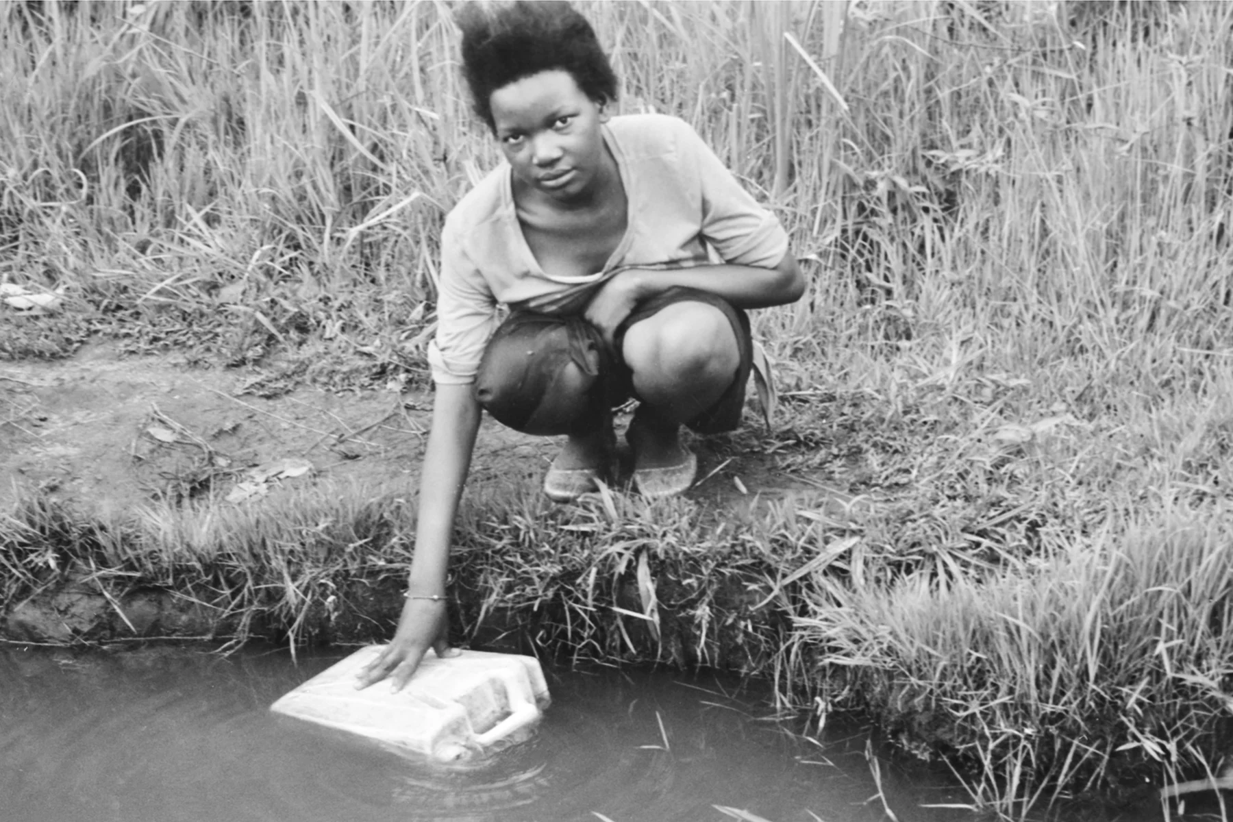 Photographer: Achieng Margaret. Age: 24 years. Occupation: Farmer. "Water. Water. Water. So much of our days are spent fetching water for cooking, washing, drinking and farming. It is difficult to access and heavy to carry so far from the source to home."
