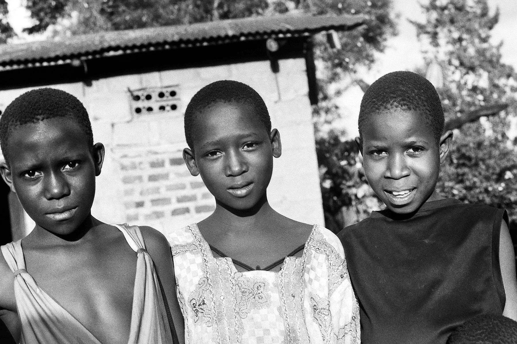 Photographer: Nalongo Bukenya. Age: 46 years. Occupation: Farmer. "I took this picture because my children asked me to show how they are friendly with their friend in the middle studying at a different school but we are neighbours. Their friend asked them that I should take a photo showing their friendship."