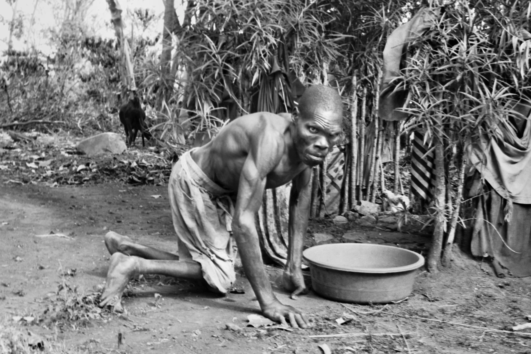 Photographer: Nassali Marriam. Age: 39 years. Occupation: Farmer. "The disabled or elderly people in our community are so vulnerable and struggle so much because they cannot be catered by others. This man struggles to do simple tasks such as carry water for bathing. He cooks for himself sometimes. He sometimes digs for himself. He never produced children. My heart goes out to him. it is a very difficult life."