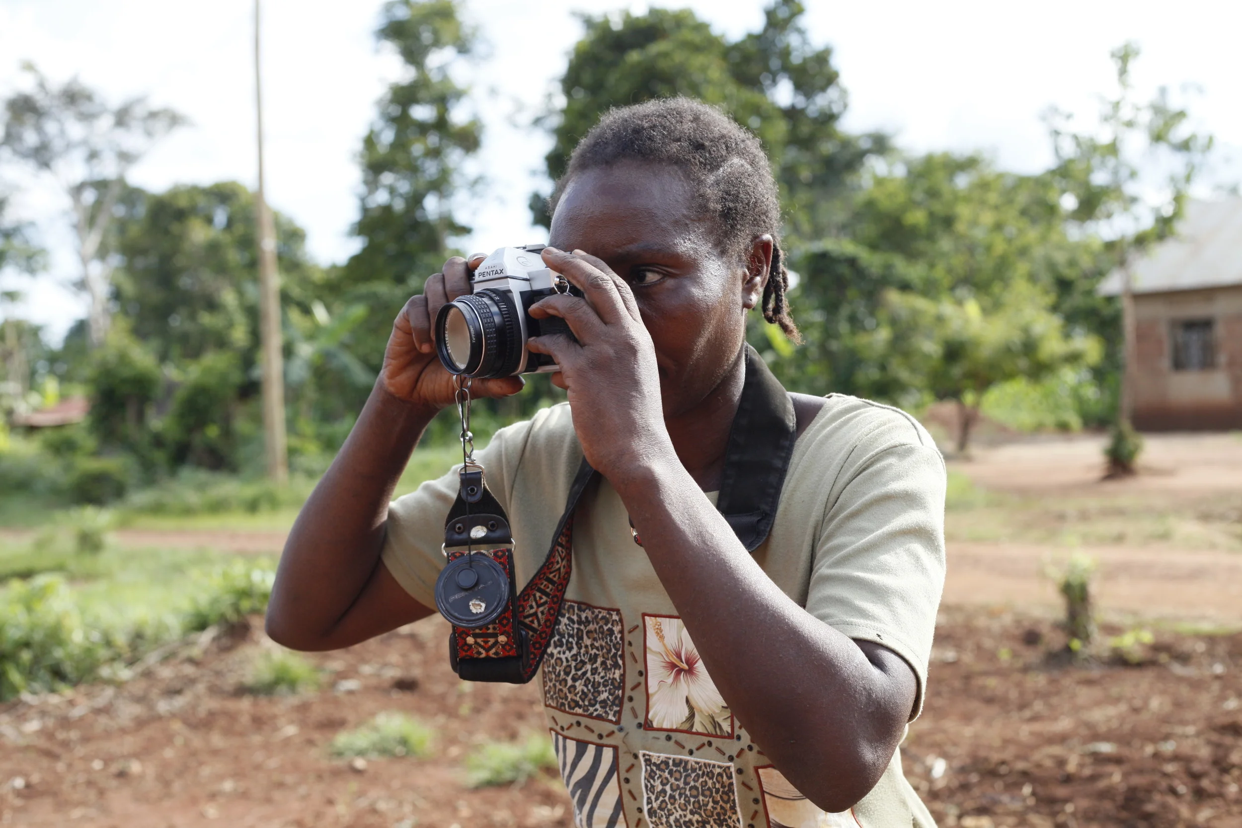  WPC Member Babigumira Florence learning to become confident with using her camera on her own.&nbsp; 