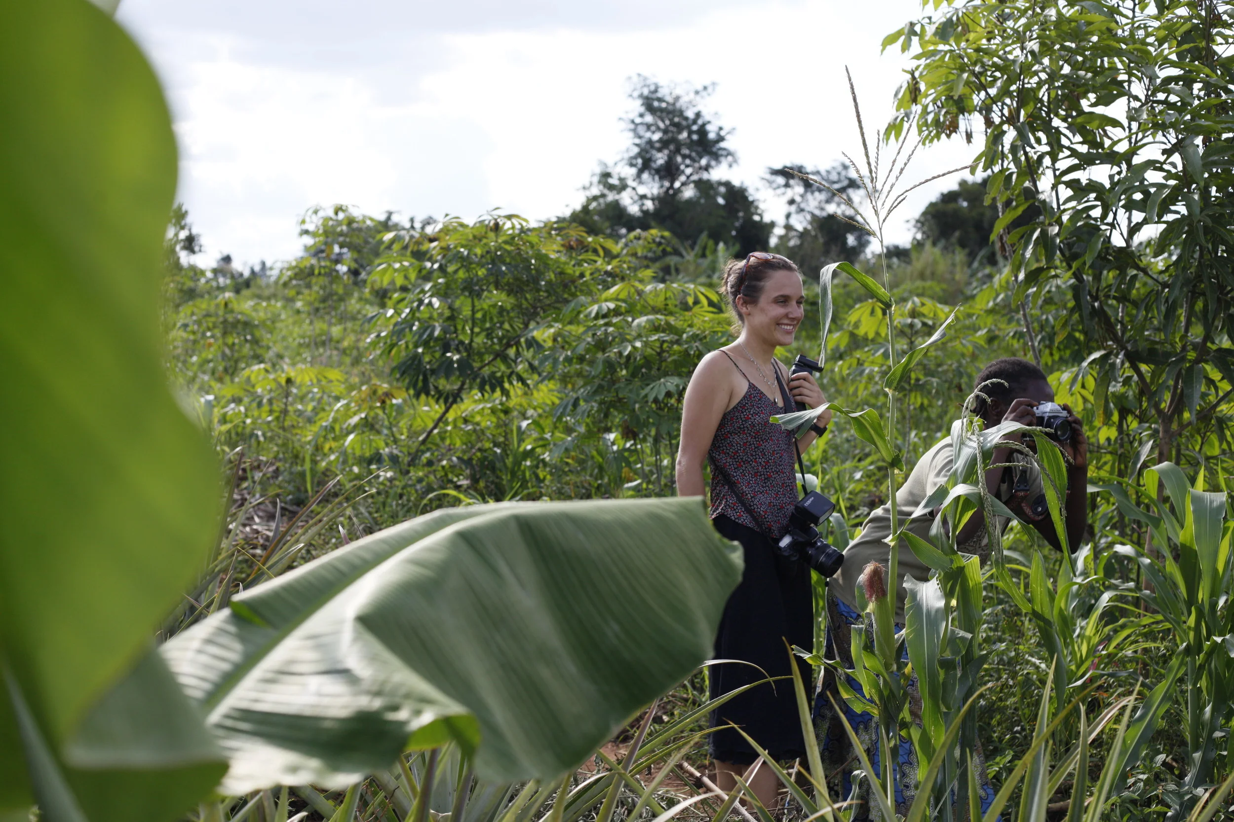  Having a great time putting those photographic skills to work! Shooting in the field with Project Director Louise Rita Contino and WPC Member Babigumira Florence.&nbsp; 