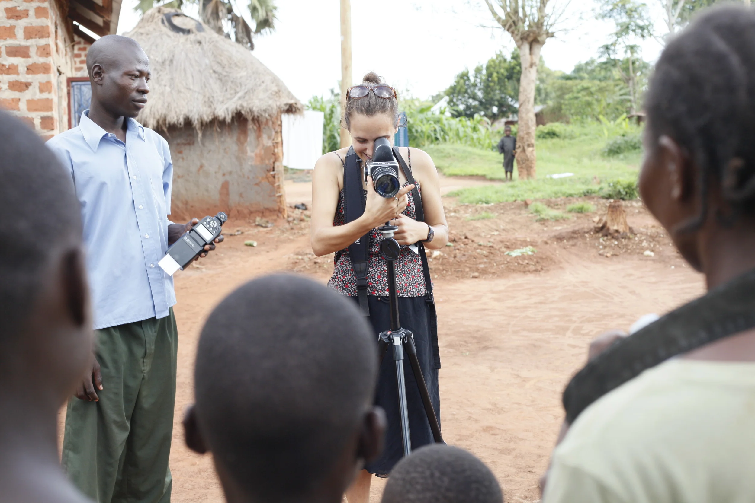  This photo illustrates how the lens was turned both ways in this participatory photography project. WPC members explored what it felt like to be the photographer, casting their glance on a scene or person(s), and what it felt like to be the subject 