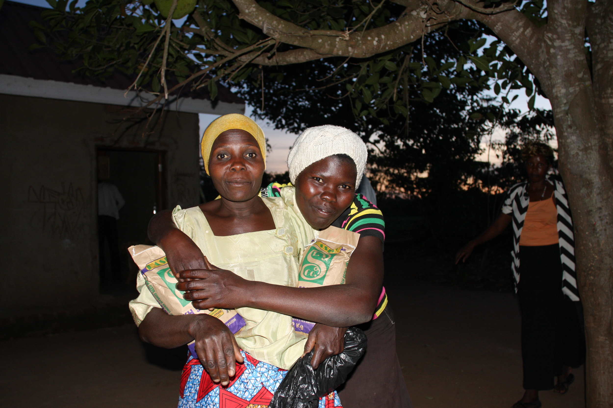  One of the greatest things that this project accomplished for all participants was to strengthen community ties and nurture new and old friendships. Featured here are two WPC members, Nalongo Bukenya and Achieng Margaret (from left to right), posing