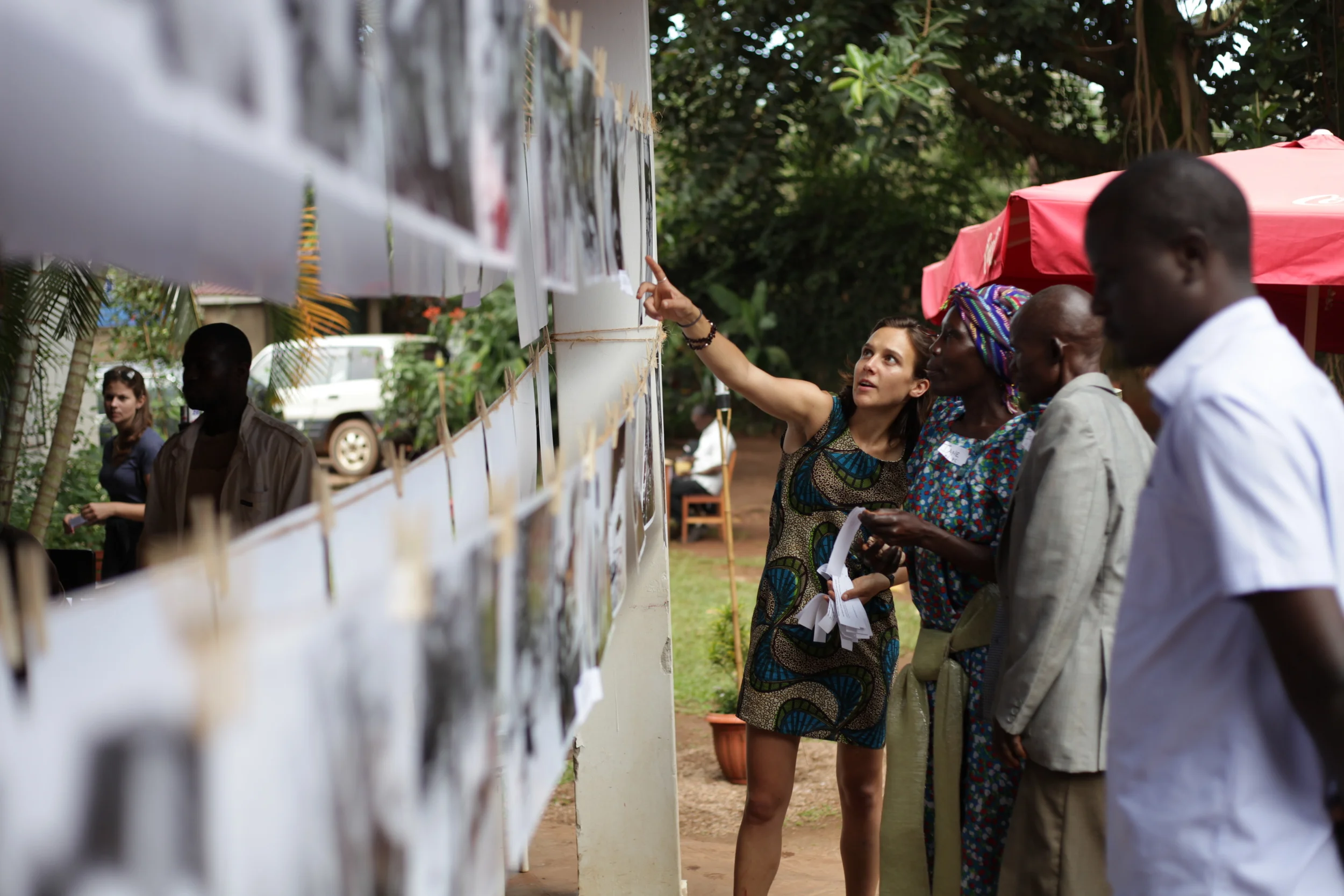  WPC members working with Louise to hang their prints for the show before the crowds arrive.&nbsp; 