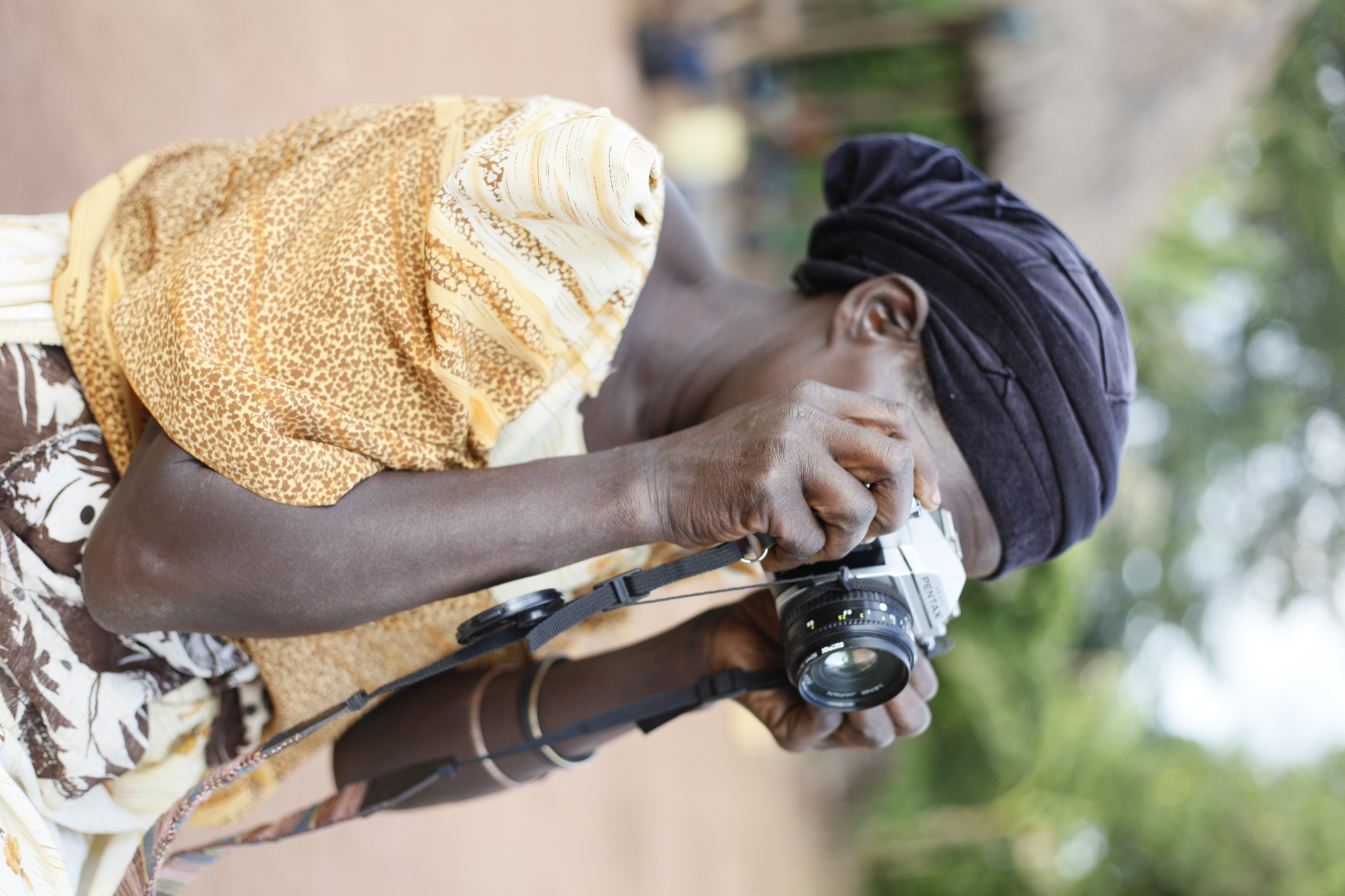 Nalongo Bukenya crafting compositions of her children and grandchildren, her favorite subject. 