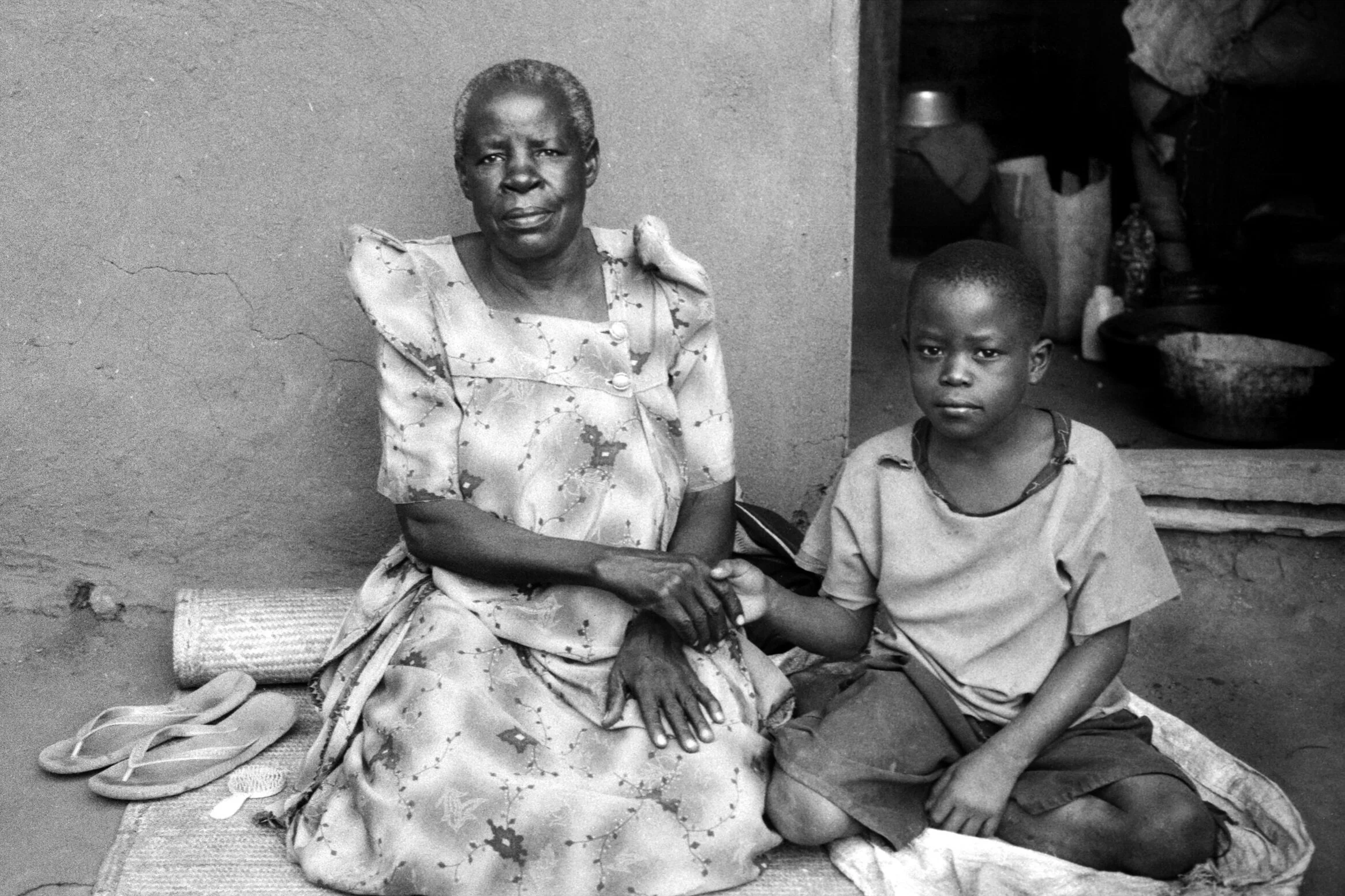  Photographer: Jamadah Mawoni.  Age 21 years. Occupation: Teacher at BESO Junior School.   “Do you see that child? There is love in his eyes. There is love in this photo. This child is mine and he is holding his JaJa’s [Grandmother’s] hand. I am a si