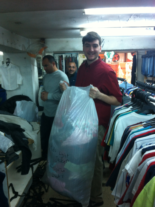  Purchasing used clothing in the markets of Amman. 
