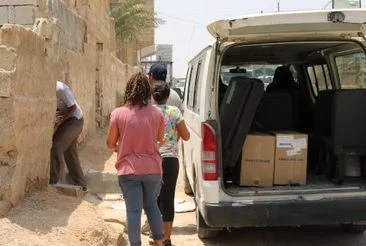 Delivering food boxes, house by house!