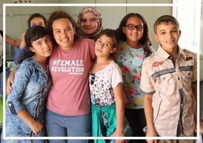 Yasmine with students at The Azraq School